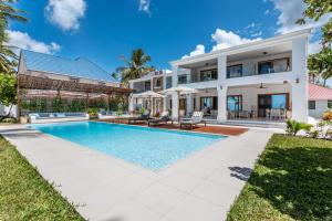 an image of a villa with a swimming pool at Villa Serene in Bwejuu