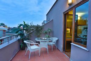 Balkón nebo terasa v ubytování Budo Hotel