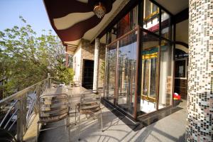 Aman Homestay, A Boutique Hotel的阳台或露台