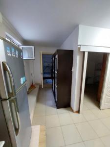 a kitchen with a stainless steel refrigerator in a room at Квартира апартамент in Politotdel