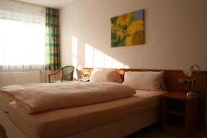 Säng eller sängar i ett rum på Aktivhotel Alter Kaiser