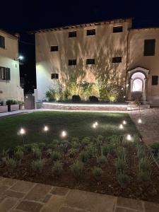 a garden in front of a building at night at Casa Sole in Stia