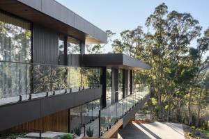 an external view of a house with glass balconies at Highstead House in Daylesford