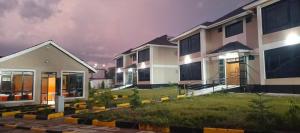 a row of houses in a city at night at Key Villa in Homa Bay