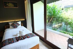 Vimarn Kaew Village and Resort客房内的一张或多张床位