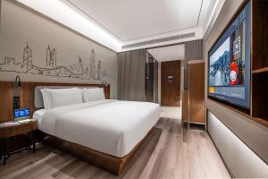 Postel nebo postele na pokoji v ubytování UrCove by Hyatt Shenzhen Bay Nanyou
