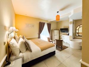 Postel nebo postele na pokoji v ubytování Hotel Le Cilaos