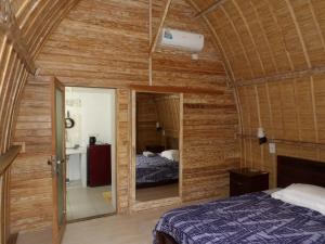 Ένα ή περισσότερα κρεβάτια σε δωμάτιο στο Lala Home Stay