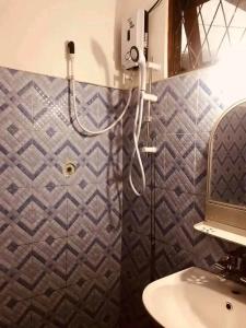 a bathroom with a shower and a sink at The paulwood cabana and Bungalow in Nuwara Eliya