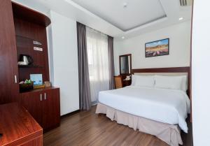 Letto o letti in una camera di Dao Ngoc Hotel Da Nang