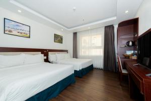 Letto o letti in una camera di Dao Ngoc Hotel Da Nang