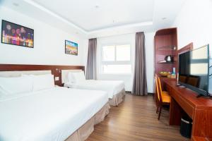 Letto o letti in una camera di Dao Ngoc Hotel Da Nang
