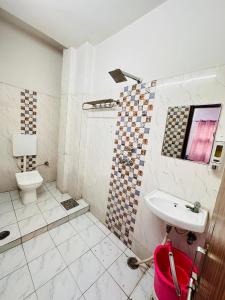 Koupelna v ubytování Hotel Aparajita