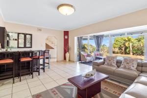 a living room with a couch and a table at Gainsford Place 26 by Host Agents in Durban