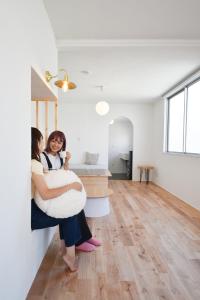 Postel nebo postele na pokoji v ubytování hoho 高松駅 港近くの1日1組限定の貸切宿