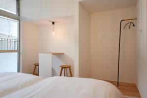 Postel nebo postele na pokoji v ubytování hoho 高松駅 港近くの1日1組限定の貸切宿
