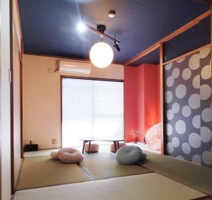 Postel nebo postele na pokoji v ubytování 立石5丁目m202
