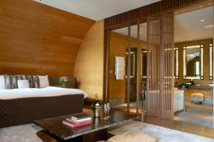 Cama o camas de una habitación en The Chedi Andermatt