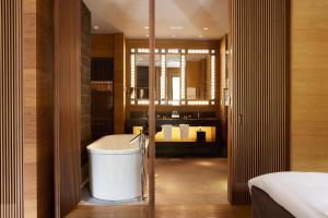 Cama o camas de una habitación en The Chedi Andermatt