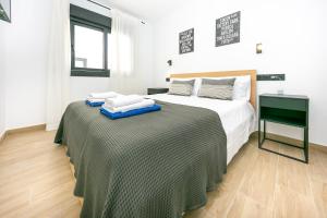 Ένα ή περισσότερα κρεβάτια σε δωμάτιο στο Moderno apartamento en el centro de Fuengirola +3 φωτογραφίες