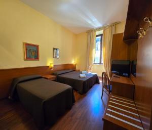 Postel nebo postele na pokoji v ubytování Hotel Azzurra