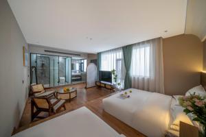 Postel nebo postele na pokoji v ubytování 山田心精品民宿 Valley Heart Inn