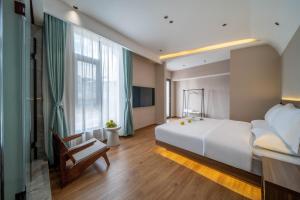 Postel nebo postele na pokoji v ubytování 山田心精品民宿 Valley Heart Inn