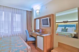 Postel nebo postele na pokoji v ubytování Budo Hotel