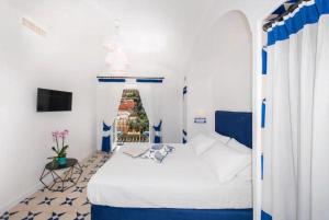 Postel nebo postele na pokoji v ubytování Hotel Punta Regina