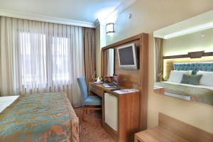 Postel nebo postele na pokoji v ubytování Budo Hotel