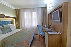 Postel nebo postele na pokoji v ubytování Budo Hotel