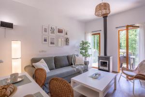 a living room with a couch and a table at Le Sureau Noir S34 - Le Val Joly in Eppe-Sauvage +5 photos