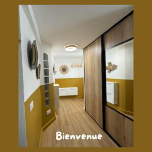 a room with a hallway with a door and a bathroom at L'appart in Bandol