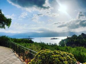 a view of the water with a boat in the distance at Windmill Apartments in Galaxidi
