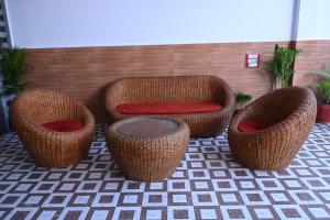 four wicker chairs and a stool in a patio at HOTEL AYODHYA PAYING GUEST in Ayodhya