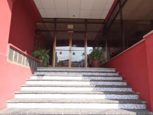 a set of stairs leading up to a building at Hotel Sevilla in Guatemala