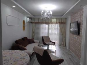 a living room with a couch and a table at Lili's Flat in Angisa