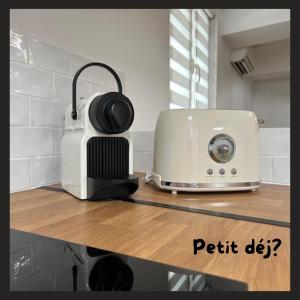 a toaster and headphones sitting on top of a counter at L'appart in Bandol
