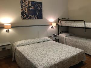 Postel nebo postele na pokoji v ubytování Hotel Ai Tufi