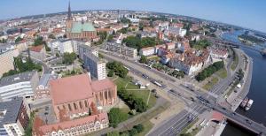 Nespecifikovaný výhled na destinaci Štetín nebo výhled na město při pohledu z apartmánu