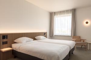 Hotel Chamade客房内的一张或多张床位