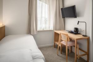 Hotel Chamade客房内的一张或多张床位