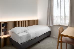 Hotel Chamade客房内的一张或多张床位