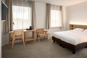 TV a/nebo společenská místnost v ubytování Hotel Chamade