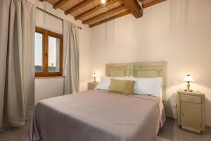 Ένα ή περισσότερα κρεβάτια σε δωμάτιο στο Casa Costarella - San Gimignano