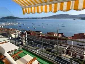 a view of a harbor with boats in the water at Dúplex con vistas al mar in Baiona