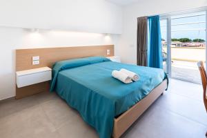 Postel nebo postele na pokoji v ubytování Hotel Maria