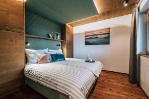 Krevet ili kreveti u jedinici u okviru objekta Almchalet - Luxus am Fuße der Koralpe