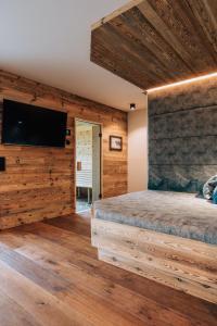 Krevet ili kreveti u jedinici u okviru objekta Almchalet - Luxus am Fuße der Koralpe