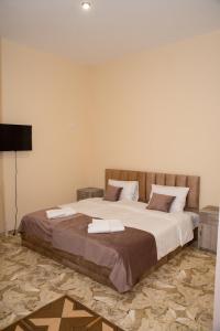 Uma cama ou camas num quarto em Magic View Hotel